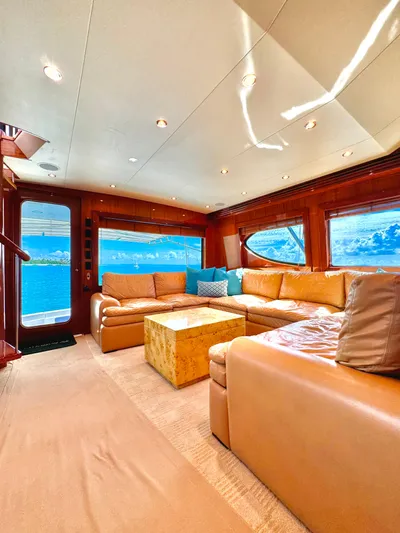 Red Queen Yacht Photos Pics Luxurious interior of a 2008 Hatteras Enclosed Bridge yacht with leather seating and ocean view.