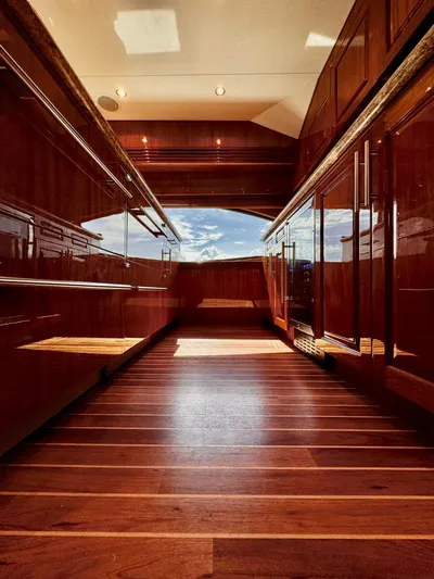 Red Queen Yacht Photos Pics Luxurious 2008 Hatteras Enclosed Bridge interior with polished wood finishes and elegant design.
