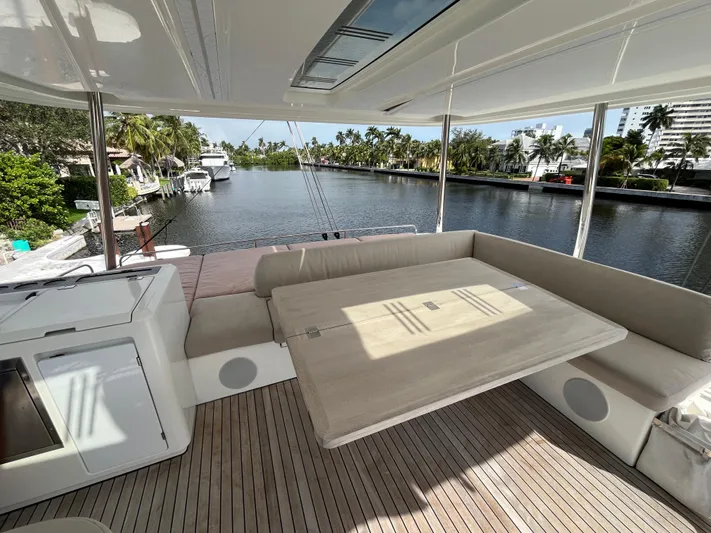  Yacht Photos Pics Lagoon 55 yacht interior, 2021 model, featuring spacious seating and scenic waterway view.