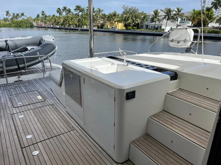  Yacht Photos Pics Lagoon 55 yacht deck, 2021 model, featuring sleek design and waterfront view.