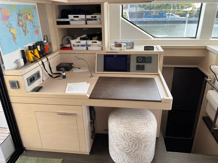  Yacht Photos Pics Modern navigation station in 2021 Lagoon 55 yacht with map and equipment.