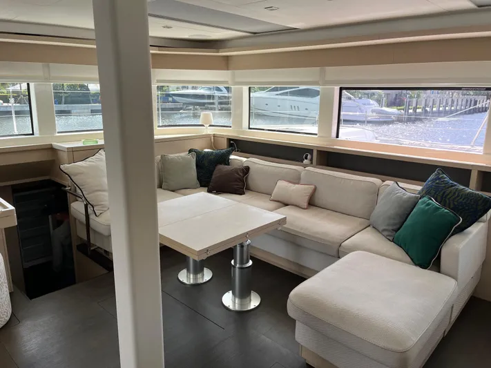  Yacht Photos Pics Luxurious interior of 2021 Lagoon 55 yacht with spacious seating and large windows.