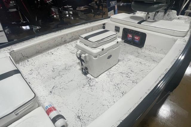 Interior of a 2020 Santee 160TS boat with seating and storage compartments.