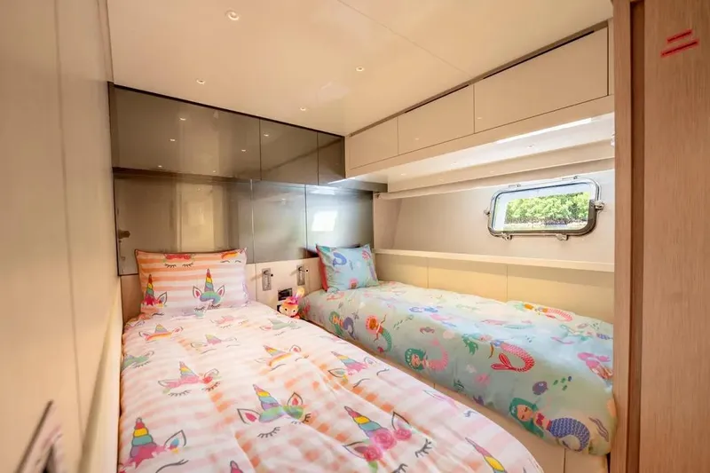  Yacht Photos Pics Twin bedroom with unicorn-themed bedding on 2021 Sanlorenzo SX76 yacht.