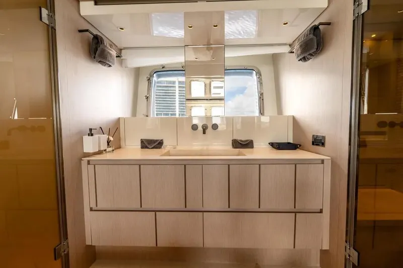  Yacht Photos Pics Luxurious bathroom interior of 2021 Sanlorenzo SX76 yacht with modern fixtures and ample storage.