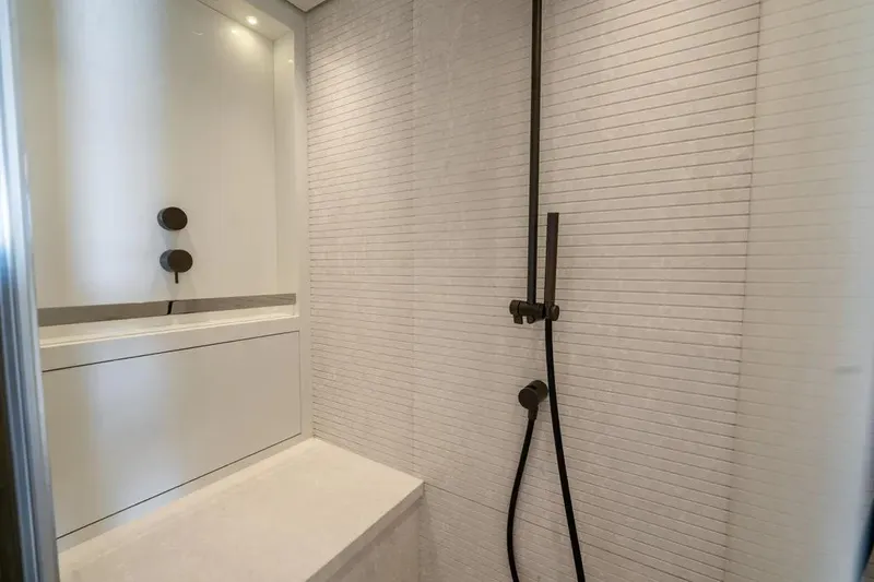  Yacht Photos Pics Modern shower area in 2021 Sanlorenzo SX76 yacht, featuring sleek fixtures and minimalist design.