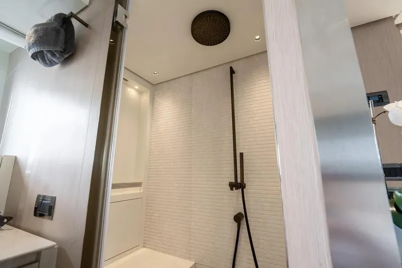  Yacht Photos Pics Modern bathroom interior on 2021 Sanlorenzo SX76 yacht, featuring sleek shower design.