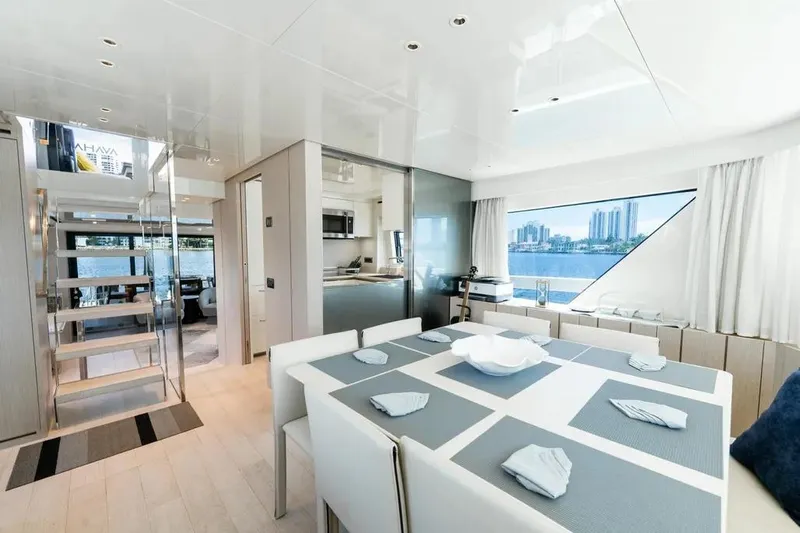  Yacht Photos Pics Luxurious interior of 2021 Sanlorenzo SX76 yacht with modern dining area and scenic window view.