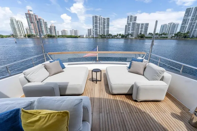  Yacht Photos Pics Luxurious 2021 Sanlorenzo SX76 yacht deck with city skyline view.