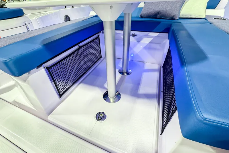  Yacht Photos Pics 2025 Axopar 37 Sun Top BRABUS Trim interior with blue seating and storage nets.
