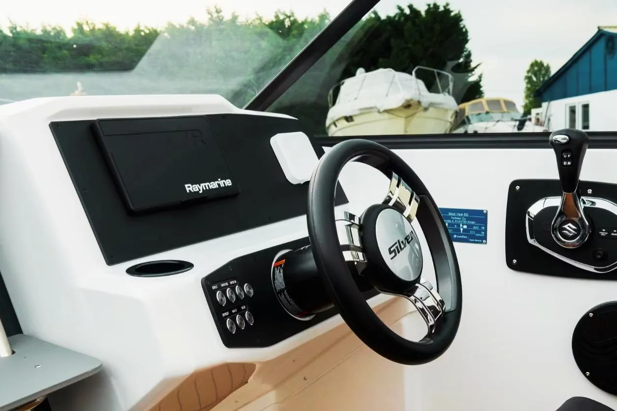 Steering console of 2025 Silver VPR DCZ boat with Raymarine equipment.