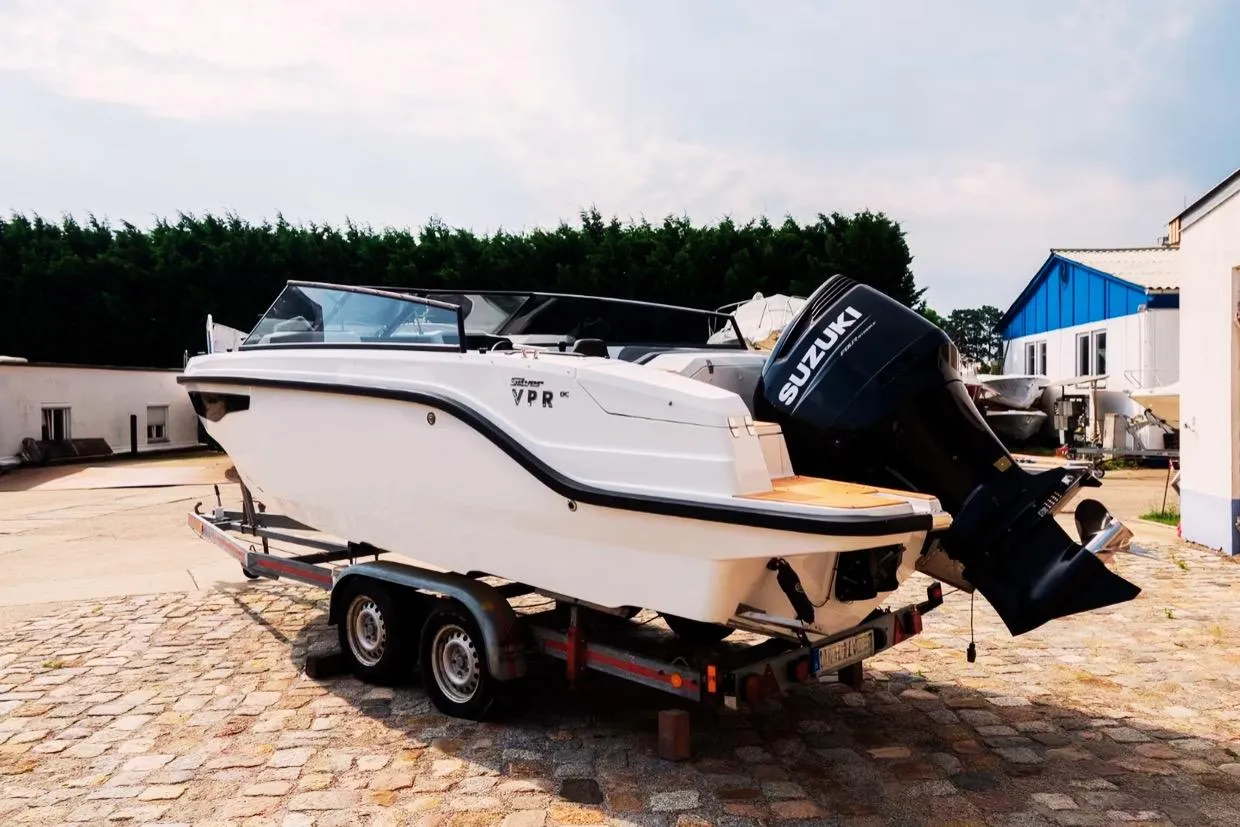 2025 Silver VPR DCZ boat on trailer with Suzuki outboard motor.