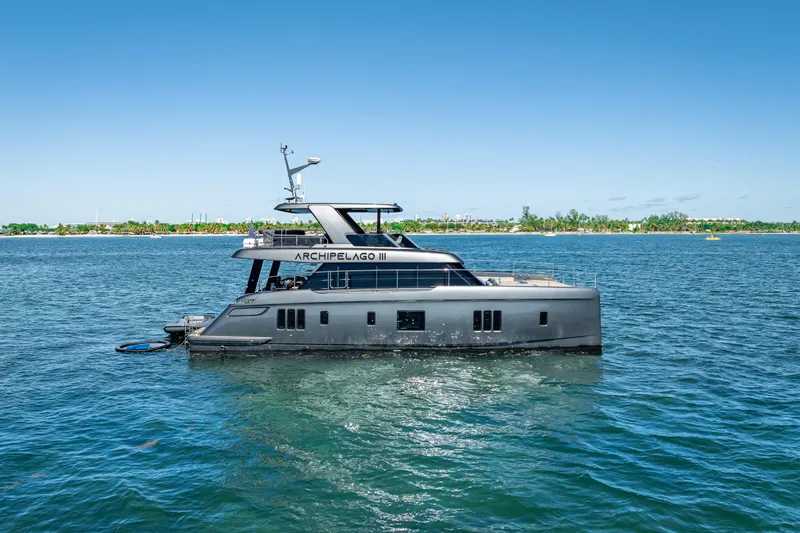 Skip The Wait Yacht Photos Pics Luxurious 2026 Sunreef 60 Power yacht cruising on a sunny day.