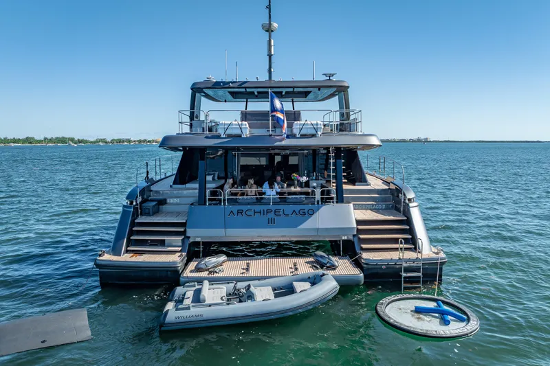 Skip The Wait Yacht Photos Pics Luxury Sunreef 60 Power yacht, 2026 model, anchored with tender and water toys.