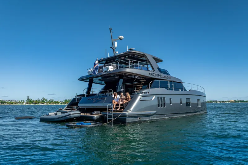 Skip The Wait Yacht Photos Pics Luxurious 2026 Sunreef 60 Power yacht on serene blue waters.