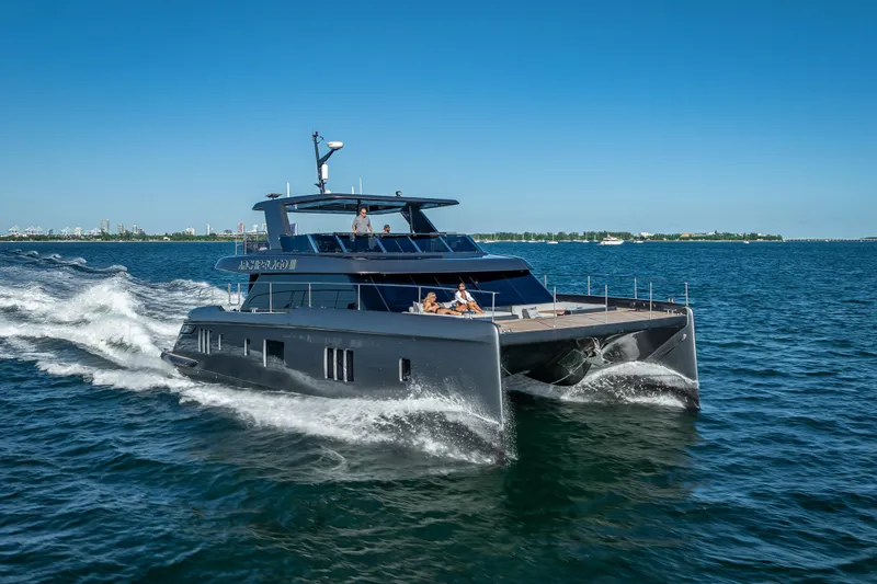 Skip The Wait Yacht Photos Pics 2026 Sunreef 60 Power yacht cruising on open water under clear blue skies.