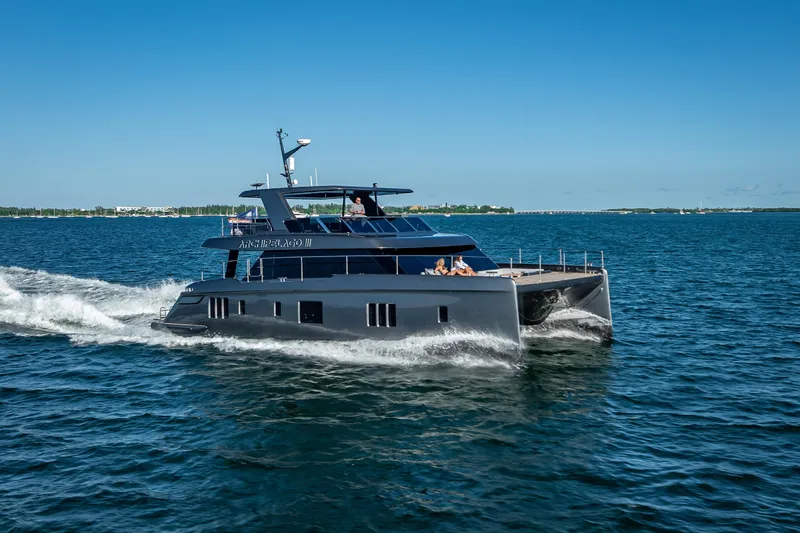Skip The Wait Yacht Photos Pics 2026 Sunreef 60 Power yacht cruising on open water under clear blue sky.