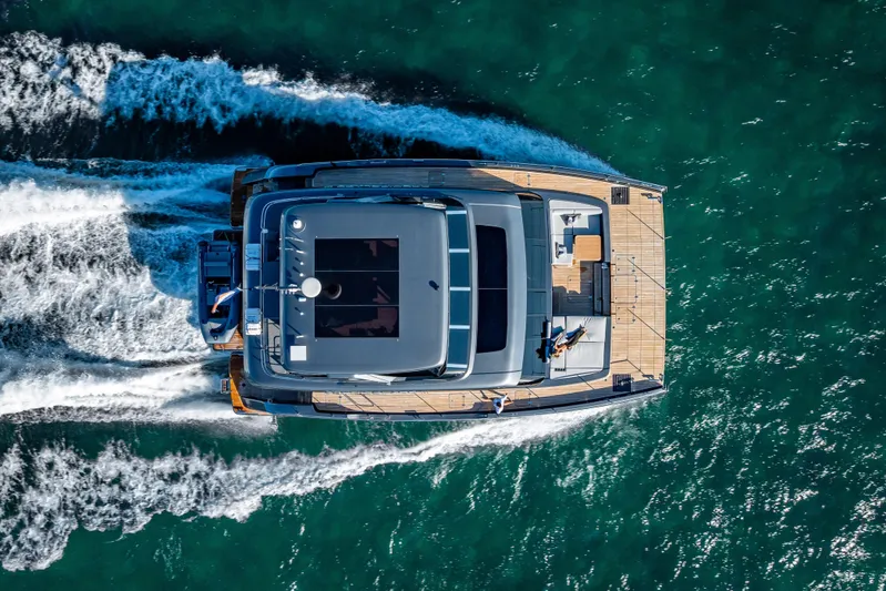 Skip The Wait Yacht Photos Pics Aerial view of 2026 Sunreef 60 Power yacht cruising on open water.