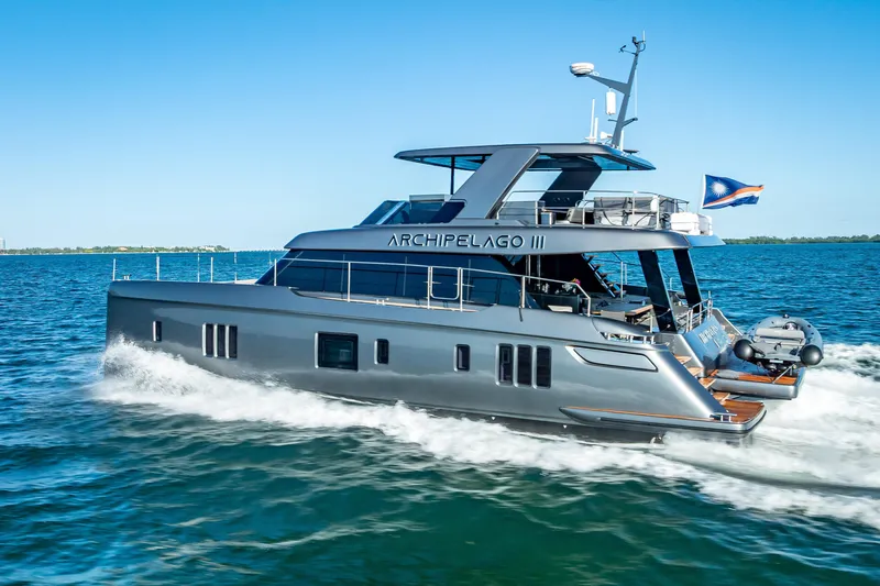 Skip The Wait Yacht Photos Pics Luxurious 2026 Sunreef 60 Power yacht cruising on open water.