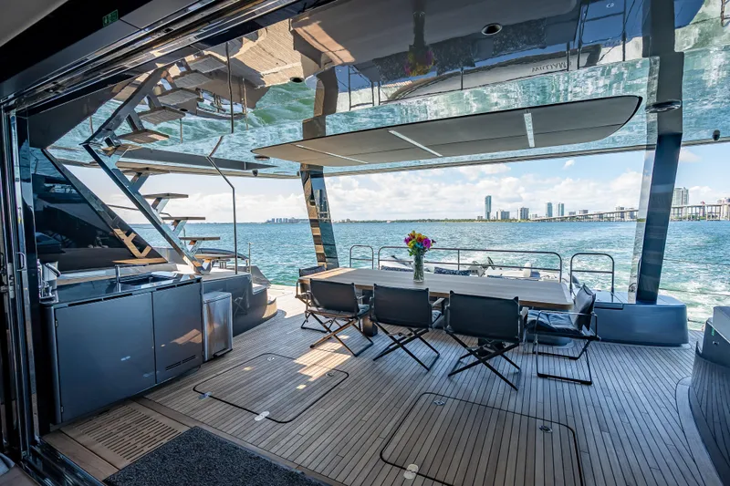 Skip The Wait Yacht Photos Pics Luxurious Sunreef 60 Power yacht interior with ocean view, modern dining area, and sleek design.