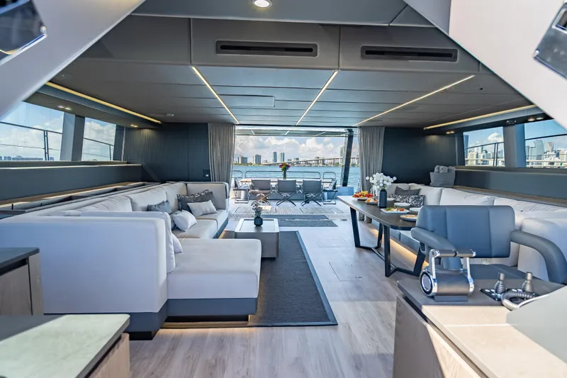 Skip The Wait Yacht Photos Pics Luxurious interior of 2026 Sunreef 60 Power yacht with modern seating and ocean view.