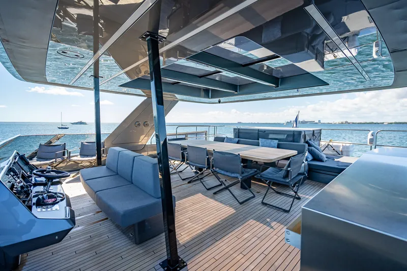 Skip The Wait Yacht Photos Pics Luxurious Sunreef 60 Power yacht deck with seating, dining area, and ocean view, 2026 model.