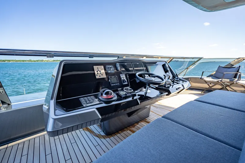 Skip The Wait Yacht Photos Pics Helm of 2026 Sunreef 60 Power yacht with ocean view and modern controls.