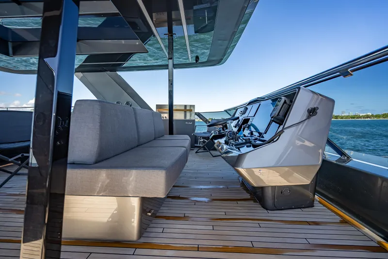 Skip The Wait Yacht Photos Pics Luxurious Sunreef 60 Power yacht deck with modern helm, sleek seating, and ocean view, 2026 model.
