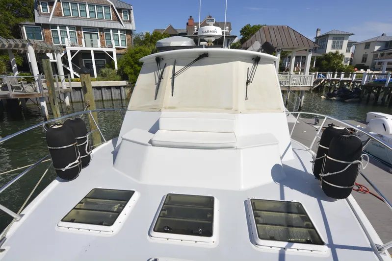 Blue Marble Explorer Yacht Photos Pics Custom 2005 P-38 Lightning Power Catamaran docked at marina with waterfront homes.