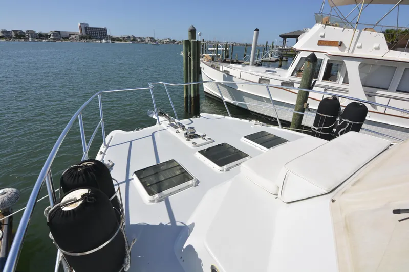Blue Marble Explorer Yacht Photos Pics Custom 2005 P-38 Lightning Power Catamaran docked at marina.