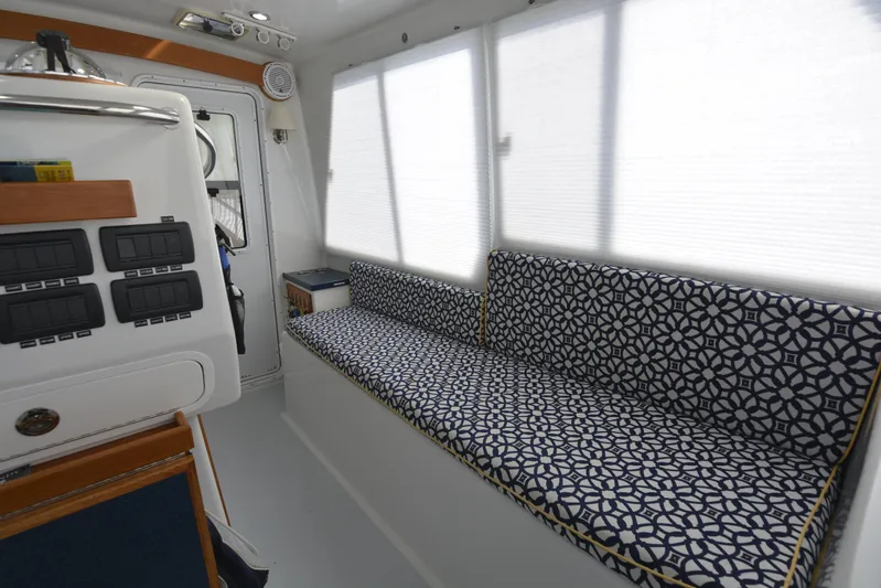 Blue Marble Explorer Yacht Photos Pics Interior of 2005 Custom P-38 Lightning Power Catamaran with patterned seating.