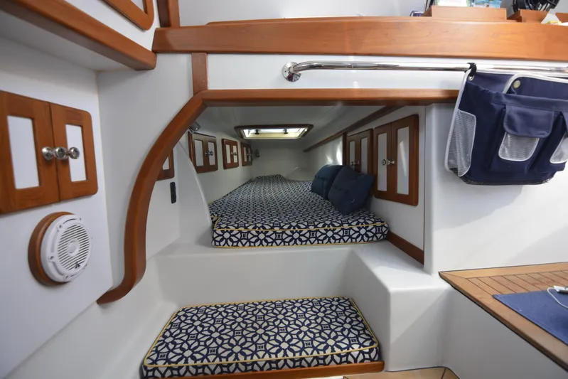 Blue Marble Explorer Yacht Photos Pics Interior cabin of a 2005 Custom P-38 Lightning Power Catamaran with patterned cushions.