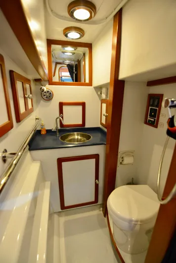 Blue Marble Explorer Yacht Photos Pics 2005 Custom P-38 Lightning Power Catamaran bathroom with sink and toilet.
