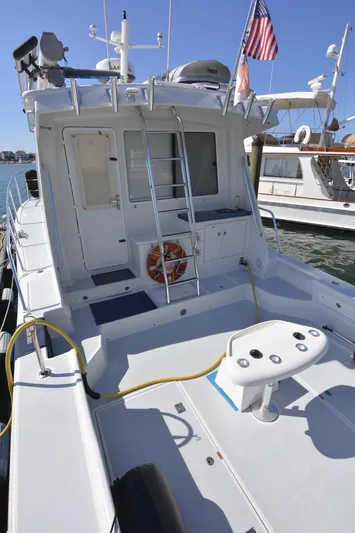 Blue Marble Explorer Yacht Photos Pics 2005 Custom P-38 Lightning Power Catamaran docked, rear deck view.