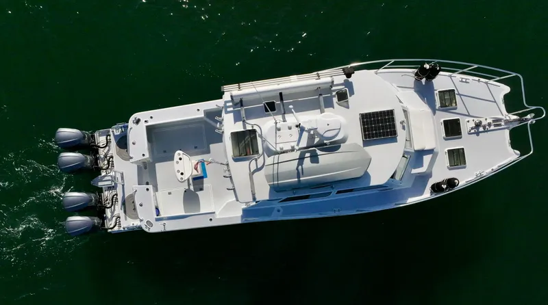 Blue Marble Explorer Yacht Photos Pics Aerial view of a 2005 Custom P-38 Lightning Power Catamaran on the water.