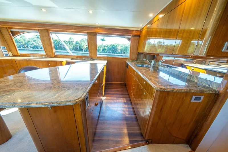 Running Over Yacht Photos Pics Luxurious interior of 2006 Viking 68 Convertible yacht with polished wood and granite finishes.