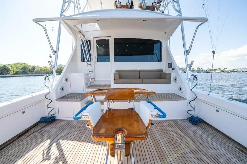 Running Over Yacht Photos Pics 2006 Viking 68 Convertible yacht deck with fishing chair and seating area.