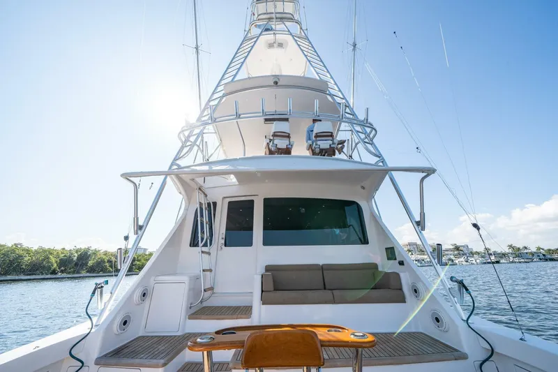 Running Over Yacht Photos Pics 2006 Viking 68 Convertible yacht on water, showcasing deck and seating area.