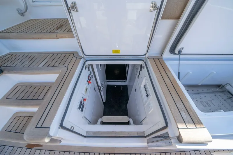 Running Over Yacht Photos Pics Open hatch on 2006 Viking 68 Convertible yacht, revealing interior access.