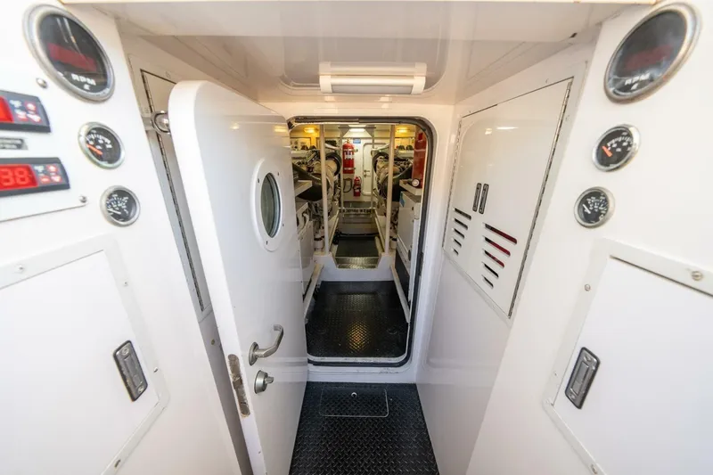 Running Over Yacht Photos Pics Engine room of 2006 Viking 68 Convertible yacht with gauges and control panels.