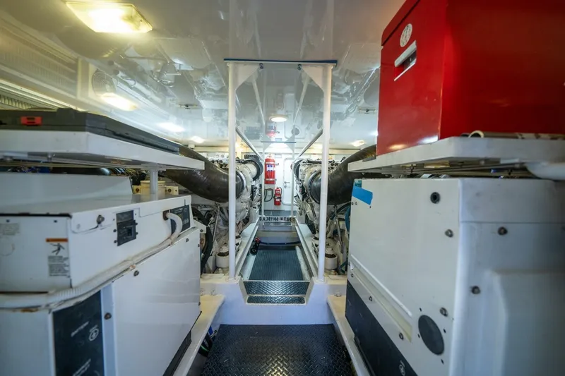 Running Over Yacht Photos Pics Engine room of 2006 Viking 68 Convertible yacht, featuring machinery and equipment.