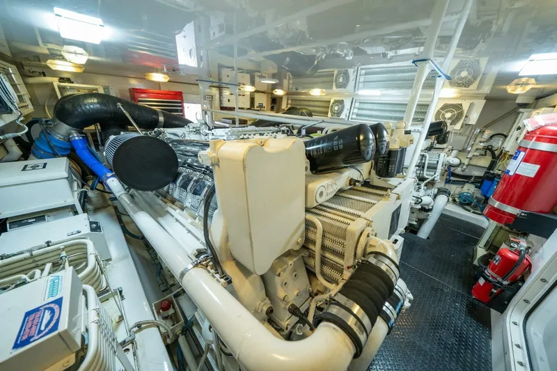 Running Over Yacht Photos Pics Engine room of 2006 Viking 68 Convertible yacht, showcasing machinery and equipment.