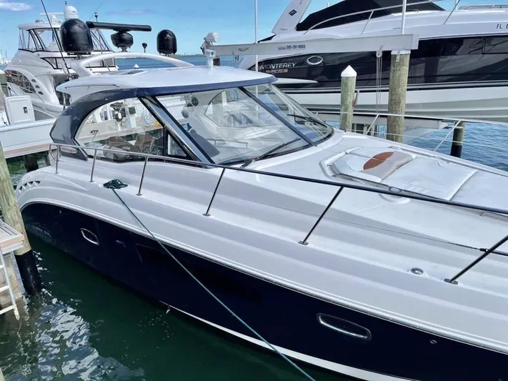  Yacht Photos Pics 2010 Chaparral Premiere 400 yacht docked at marina, side view.