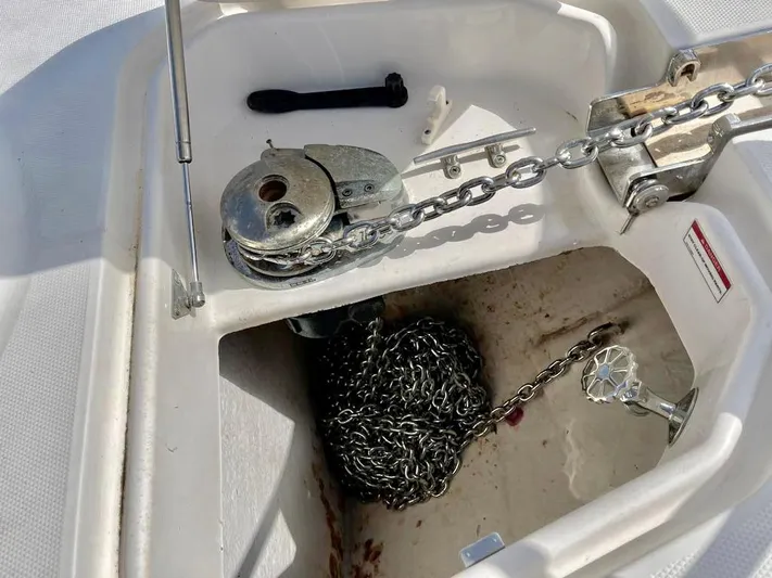  Yacht Photos Pics Anchor chain compartment of 2010 Chaparral Premiere 400 boat, featuring winch and chain storage.