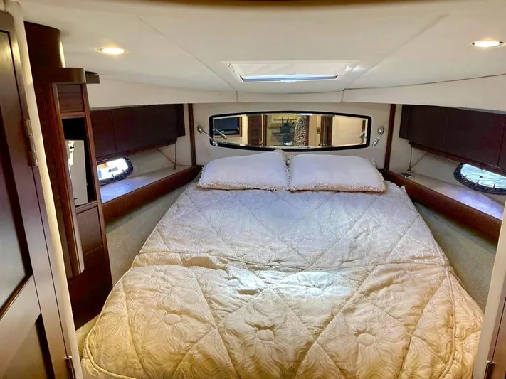  Yacht Photos Pics Luxurious bedroom interior of 2010 Chaparral Premiere 400 yacht with cozy bedding.