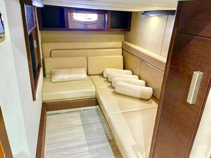 Yacht Photos Pics Luxurious interior cabin of 2010 Chaparral Premiere 400 yacht with beige seating.