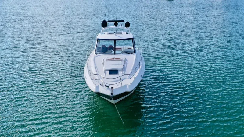  Yacht Photos Pics Chaparral Premiere 400 yacht, 2010 model, anchored on calm blue water.