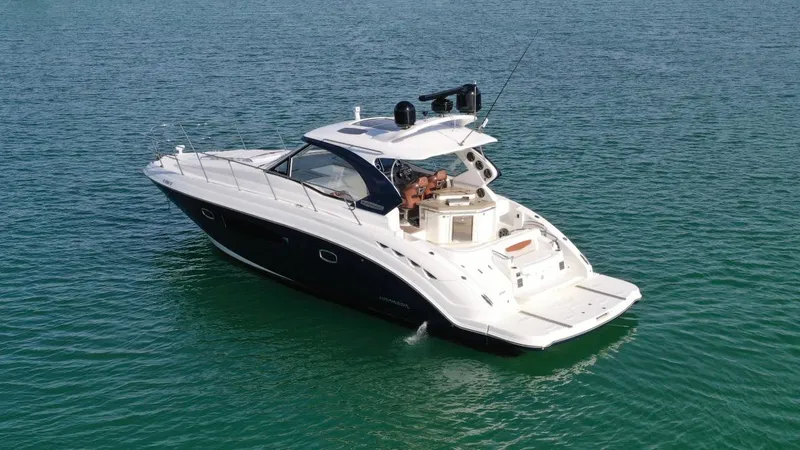  Yacht Photos Pics Chaparral Premiere 400 yacht, 2010 model, cruising on clear blue water.