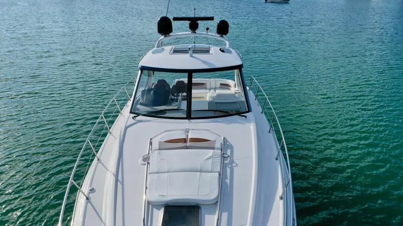  Yacht Photos Pics Chaparral Premiere 400 yacht, 2010 model, cruising on clear blue water.