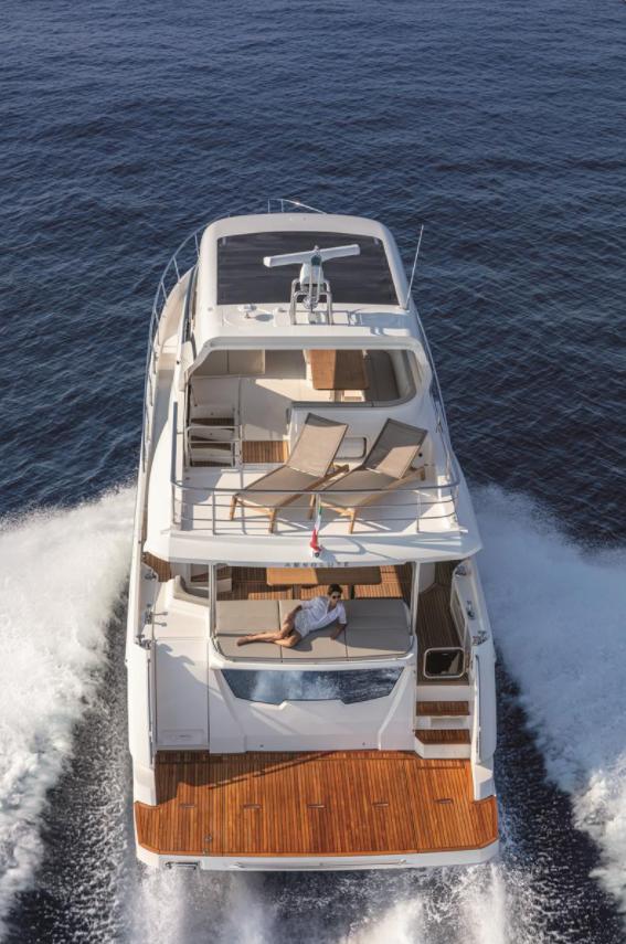 Luxury Absolute Fly Co Ownership yacht cruising on open sea, 2023 model.